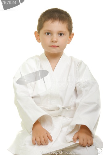 Image of Karate boy sitting on knees