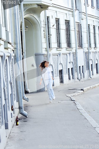 Image of Jumping girl on street