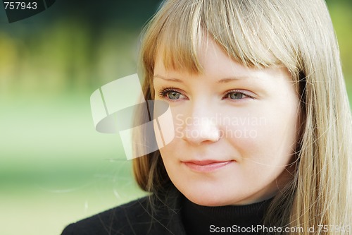 Image of Face of young serene blond woman