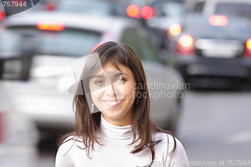 Image of Smiling brunette and traffic