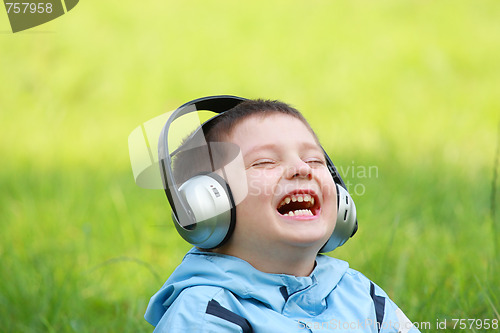 Image of Laughing boy with headphones