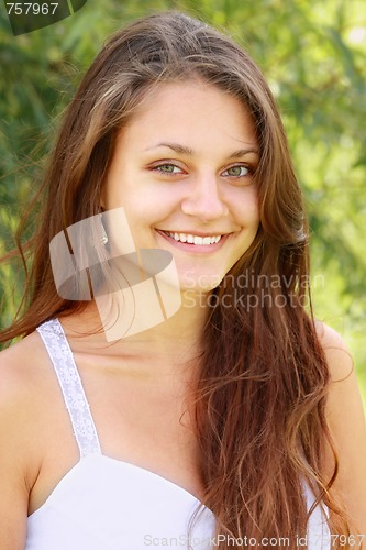 Image of Toothy smiling brunette with green eyes