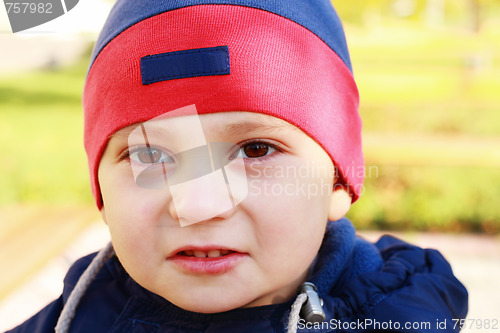 Image of Cute boy looks to camera