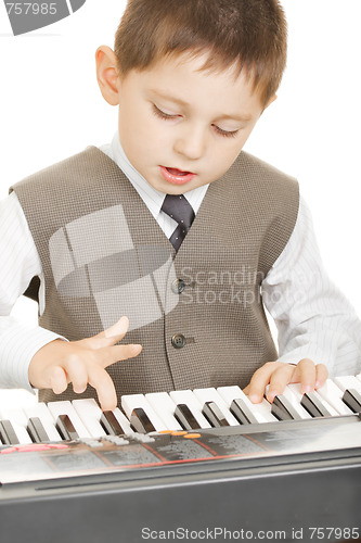 Image of Boy playing electric piano