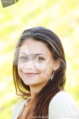 Image of Smiling brunette girl with green eyes