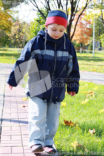 Image of Boy walks in park