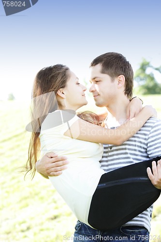 Image of Guy with girl on hands