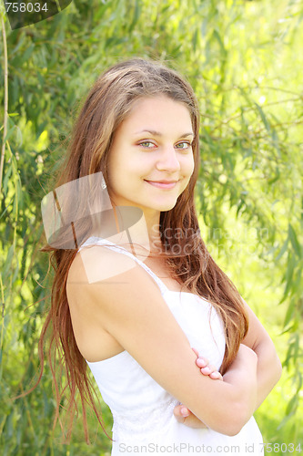 Image of Brunette holding arms folded