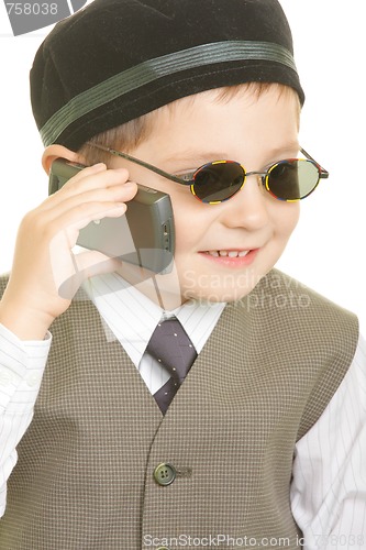 Image of Kid in black cup calling on phone