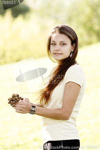 Image of Girl with acorns