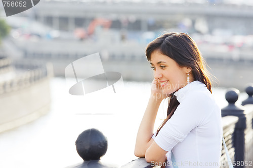 Image of Smiling girl on bridge