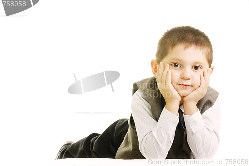 Image of Boy laying down against white
