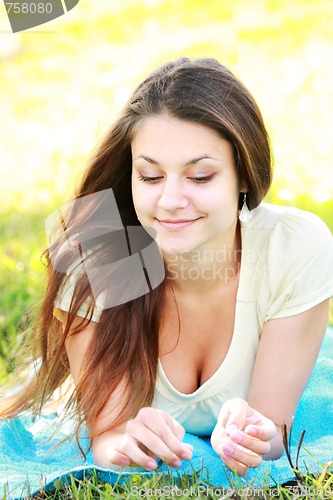 Image of Relaxed brunette outdoors