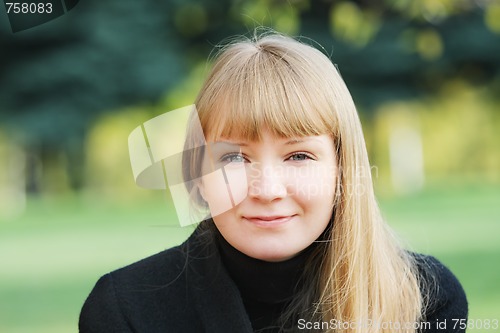 Image of Woman in black overcoat