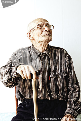 Image of Senior man in eyeglasses looking up