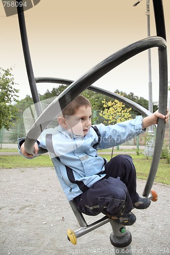 Image of Boy on metallic construction