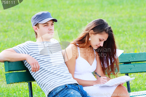 Image of Couple sitting on bench