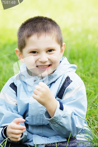 Image of Smiling boy in grass