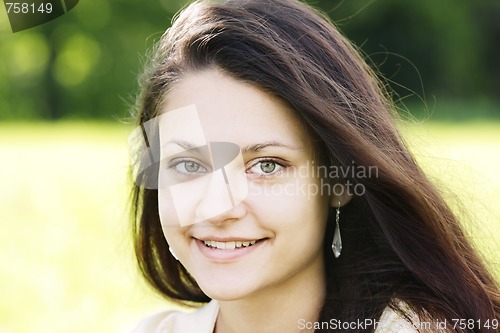 Image of Smiling brunette with green eyes