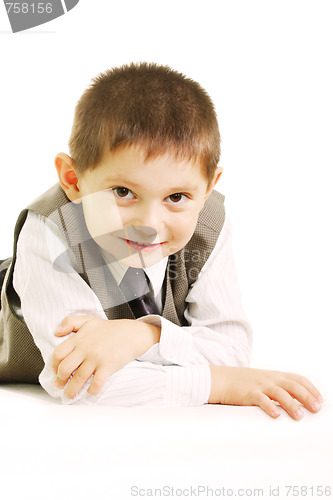 Image of Funny kid laying against white