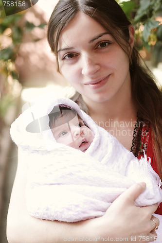 Image of Mother holding little doughter