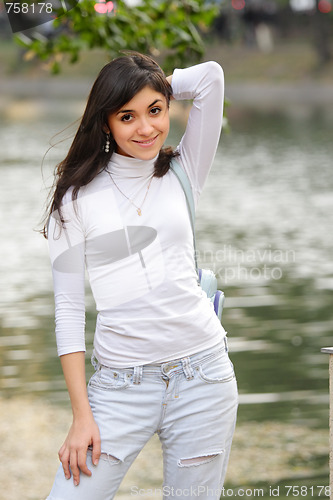 Image of Brunette in casual at pond