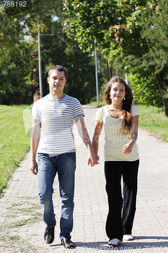 Image of Couple walking in park