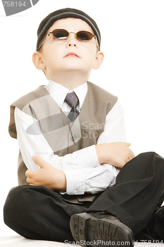 Image of Kid in sunglasses looks up
