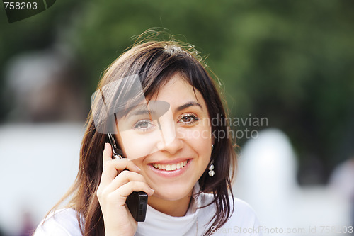 Image of Brunette with phone