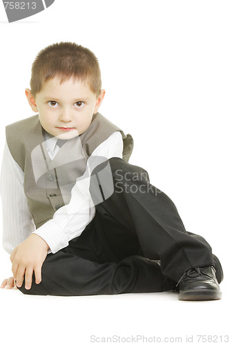 Image of Kid sitting on white ground