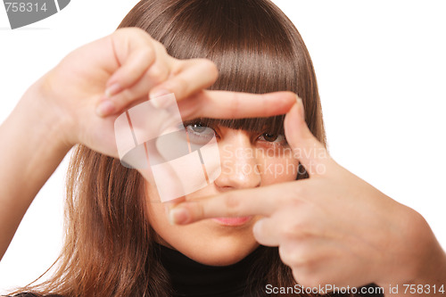 Image of Intent gaze through finger frame