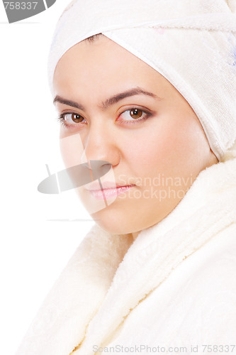 Image of Serious woman in bathrobe sideview