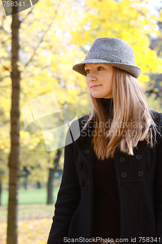 Image of Woman in autumn park