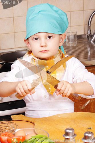 Image of Little cook sharpening knives