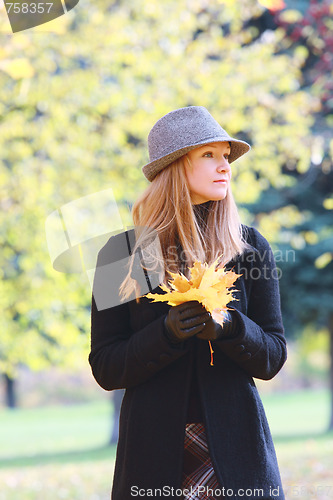 Image of Blonde with autumn leaves