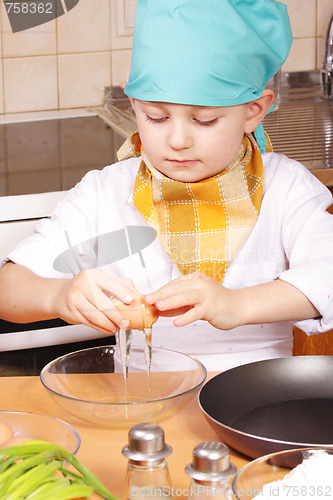 Image of Little cook breaking egg