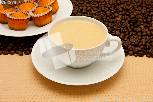 Image of White cup of coffee and coffee beans