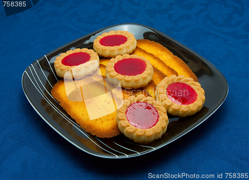 Image of cookies on a Plate on a blue background 