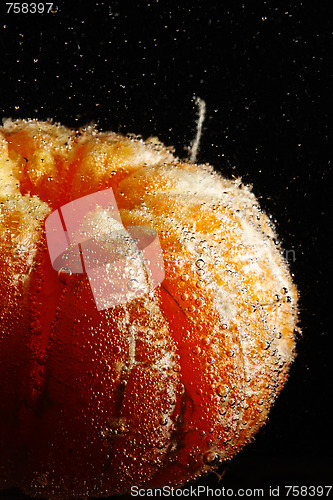 Image of Peeled mandarine in bubbles