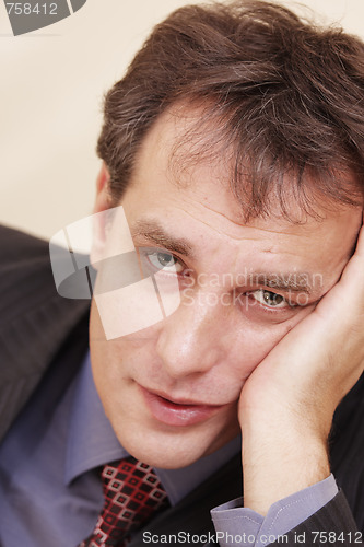 Image of Portrait of tired businessman