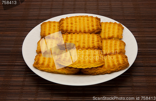 Image of plate of cookies on dark brown background