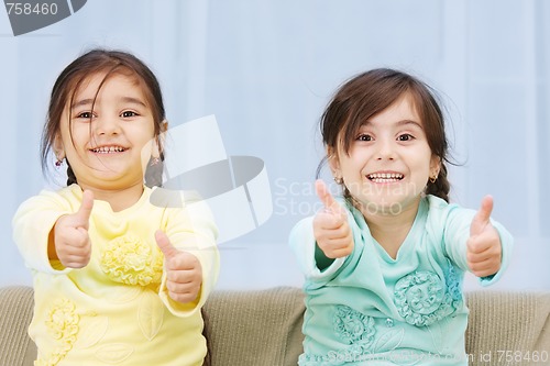 Image of Little sisters thumbs up