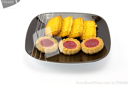 Image of cookies on plate isolated on white backgrounds