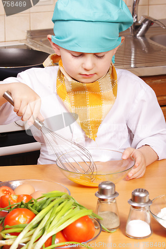 Image of Little cook beating up eggs