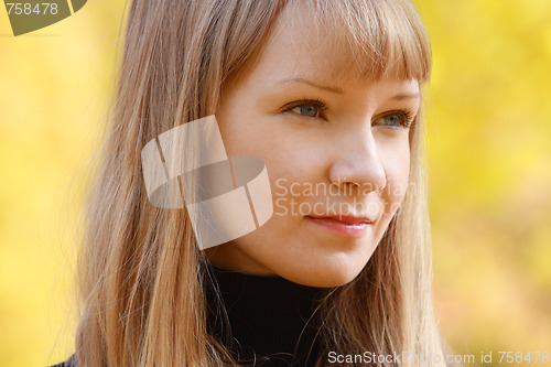 Image of Blonde against autumn blur
