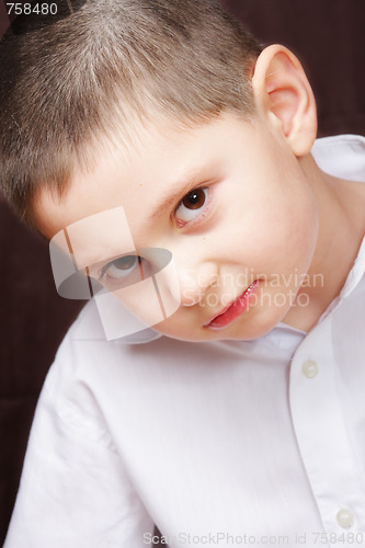 Image of Boy in white shirt inclining right