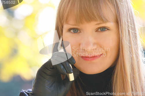 Image of Smiling blonde with phone