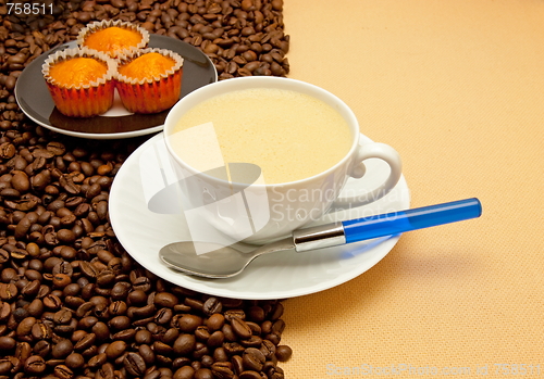 Image of White cup of coffee and coffee beans