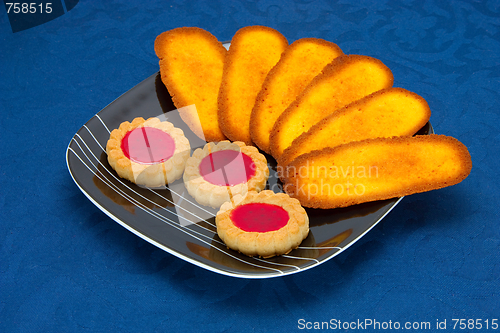 Image of cookies on a Plate on a blue background 