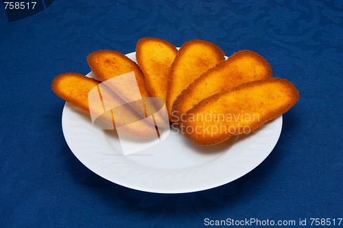 Image of cookies on a Plate on a blue background 